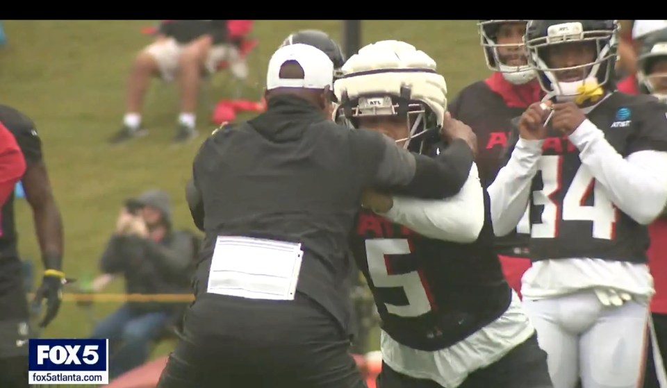 Screenshot of football players practicing.