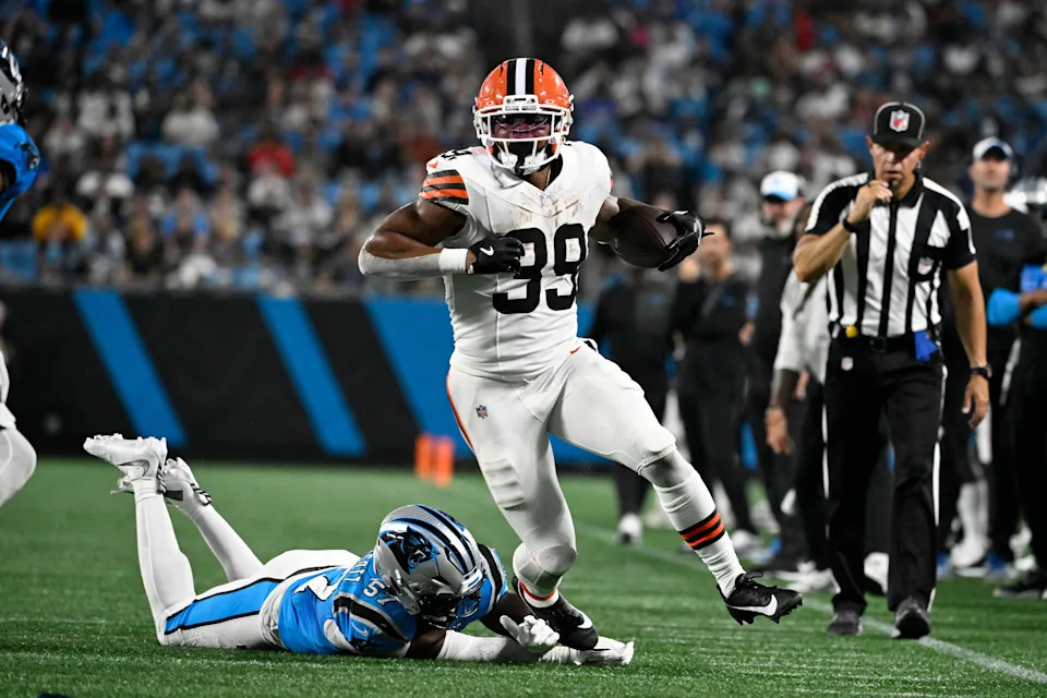 Aug 8, 2025; Charlotte, North Carolina, USA; Cleveland Browns running back Ahmani Marshall (39) with the ball as Carolina Panthers linebacker Bam Martin-Scott (57) defends in the third quarter at Bank of America Stadium. Mandatory Credit: Bob Donnan-Imagn Images