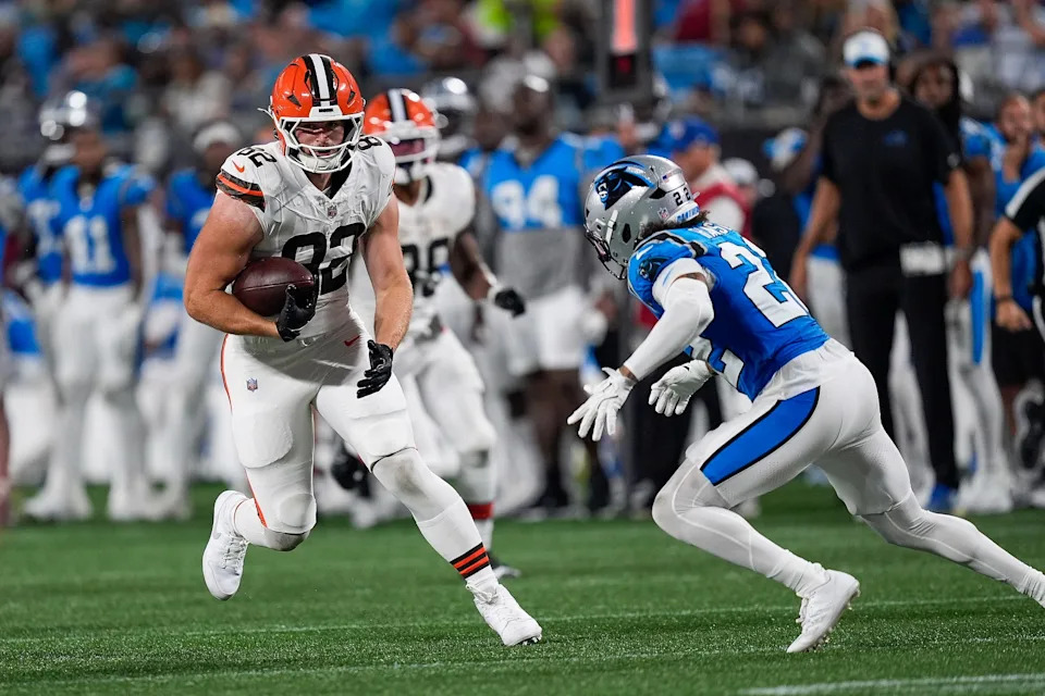 Aug 8, 2025; Charlotte, North Carolina, USA; Cleveland Browns tight end Brenden Bates (82) tries to elude Carolina Panthers safety Lathan Ransom (22) during the second half at Bank of America Stadium. Mandatory Credit: Jim Dedmon-Imagn Images