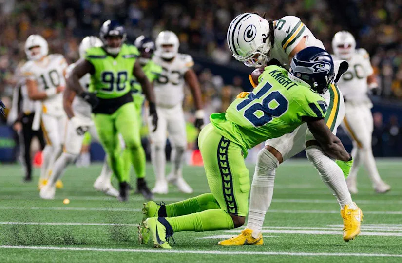 Seattle Seahawks linebacker Tyrice Knight (48) tackles Green Bay Packers wide receiver Christian Watson (9) during the third quarter of the game at Lumen Field, on Sunday, Dec. 15, 2024, in Seattle, Wash. Brian Hayes/bhayes@thenewstribune.com