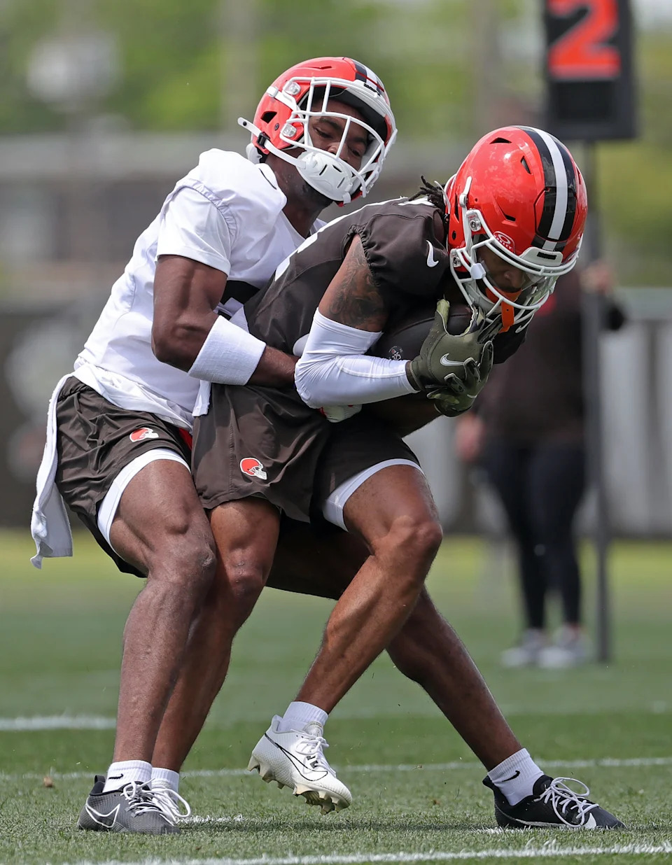 Cleveland Browns wide receiver Gage Larvadain (84) is stopped short of the goal line by cornerback Dom Jones (37) during practice at NFL minicamp, Tuesday, June 10, 2025, in Berea, Ohio. [Jeff Lange/Beacon Journal]