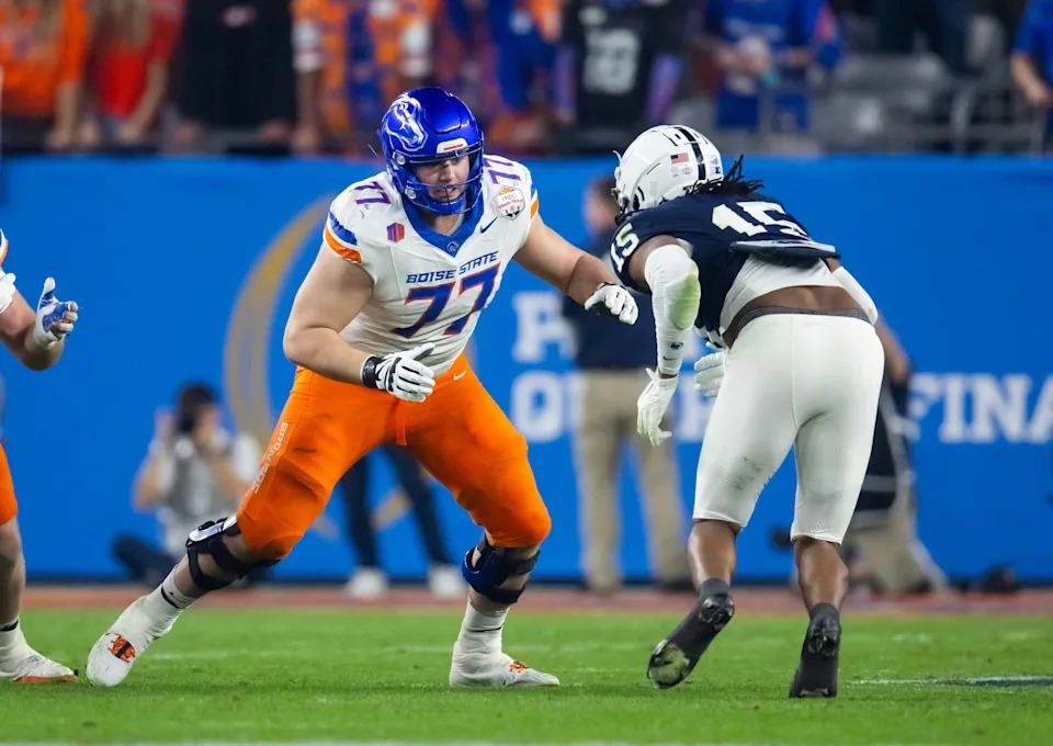 Dec 31, 2024; Glendale, AZ, USA; Boise State Broncos offensive tackle Kage Casey (77) against the Penn State Nittany Lions during the Fiesta Bowl at State Farm Stadium. Mandatory Credit: Mark J. Rebilas-Imagn Images