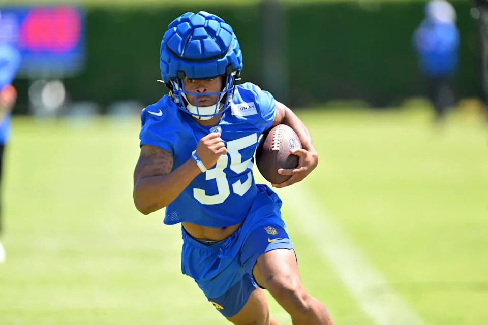 Rams running back Jarquez Hunter carries the ball in practice on July 26.
