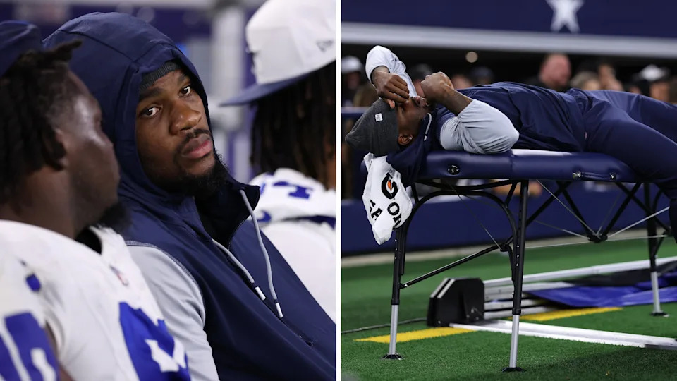 Micah Parsons on the sidelines lying on a table during a Dallas Cowboys game