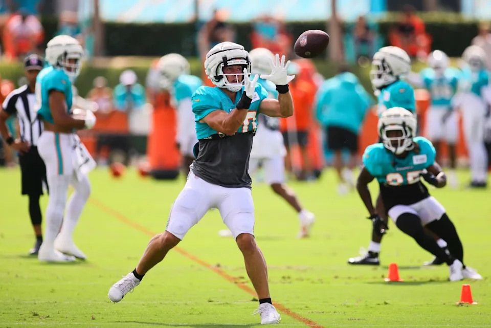 Aug 6, 2024; Miami Gardens, FL, USA; Miami Dolphins tight end Tanner Conner (80) catches the football during a joint practice with the Atlanta Falcons at Baptist Health Training Complex. © Sam Navarro-Imagn Images