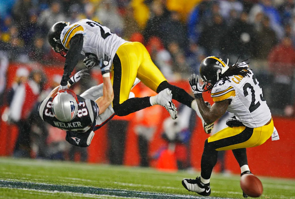Hits on receivers have been one of the key points of rule enforcement in the NFL this century. (Photo by Jim Davis/The Boston Globe via Getty Images)