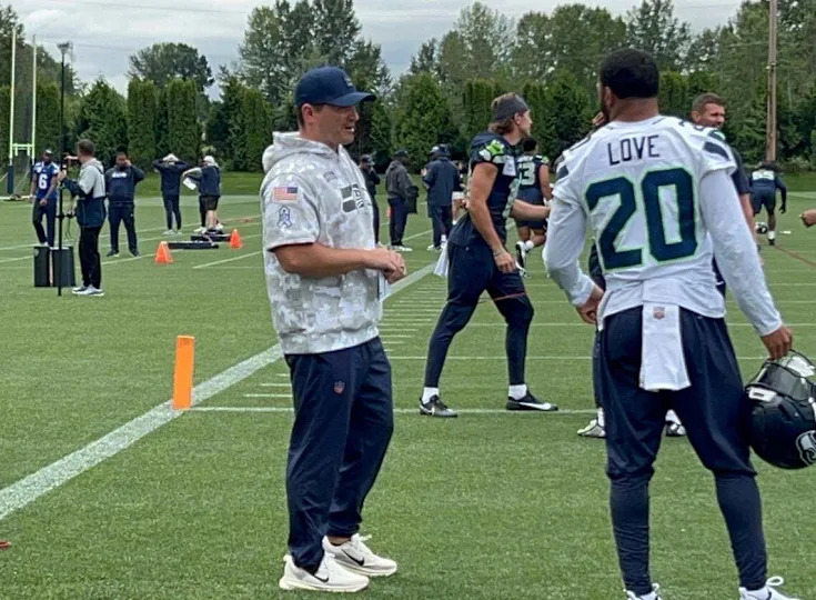 Coach Mike Macdonald talks with 2023 Pro Bowl safety Julian Love at the start of the fifth practice of Seahawks organized team activities June 4, 2025, at the Virginia Mason Athletic Center in Renton.