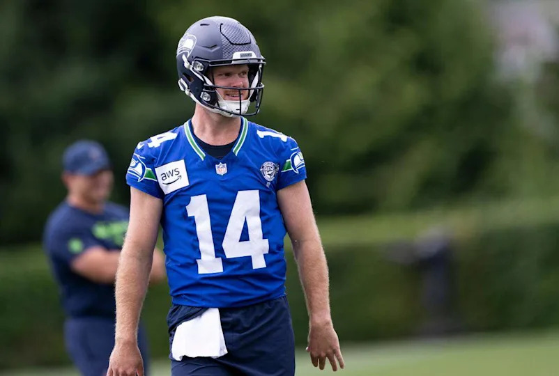 Seattle Seahawks quarterback Sam Darnold (14) reacts to a pass during training camp at Virginia Mason Athletic Center on Friday, July 25, 2025, in Renton, Wash. Brian Hayes/bhayes@thenewstribune.com