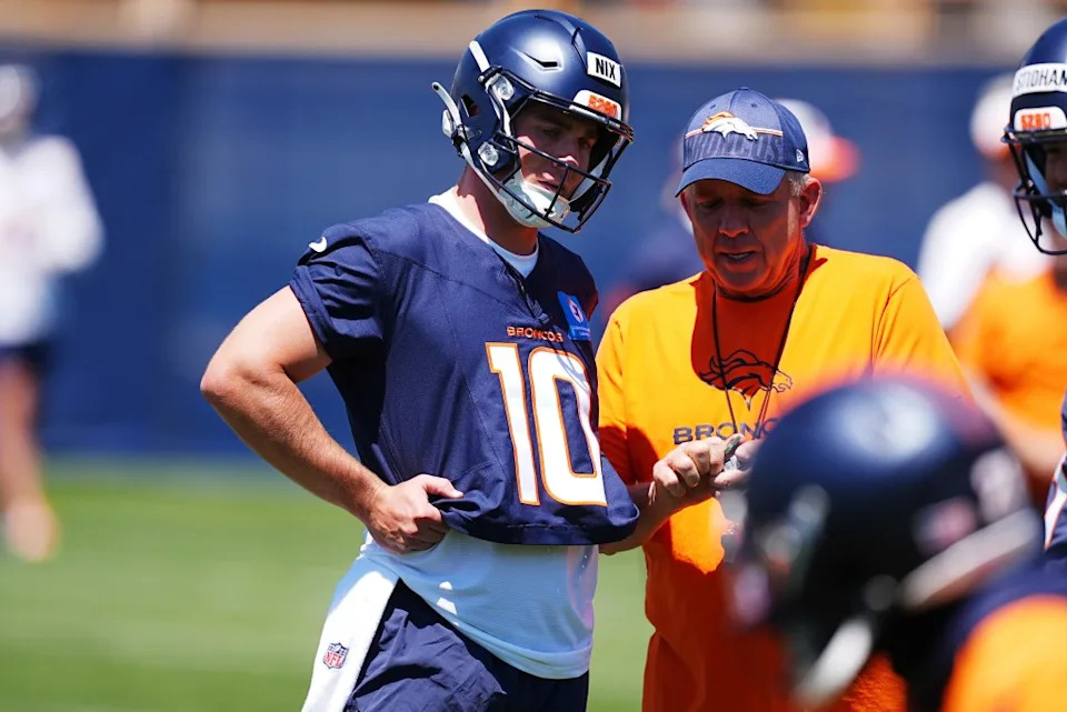 Bo Nix and Sean Payton talk at Broncos minicamp in June. AP