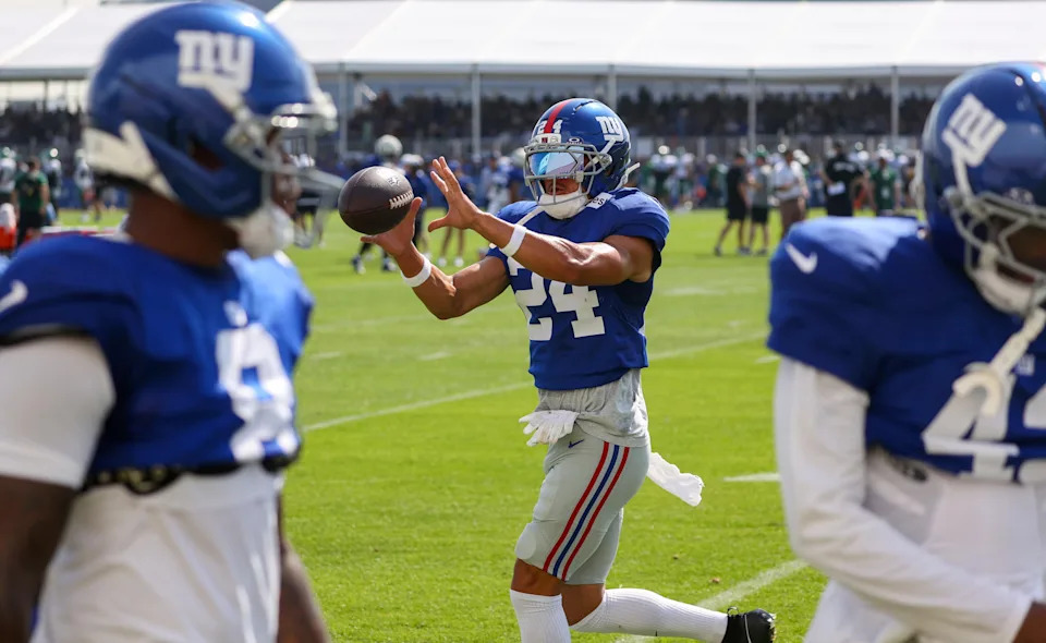 New York Giants safety Dane Belton (24) participates in drills during a joint training camp practice with the New York Jets, Wednesday, August 13, 2025, in East Rutherford, N.J.