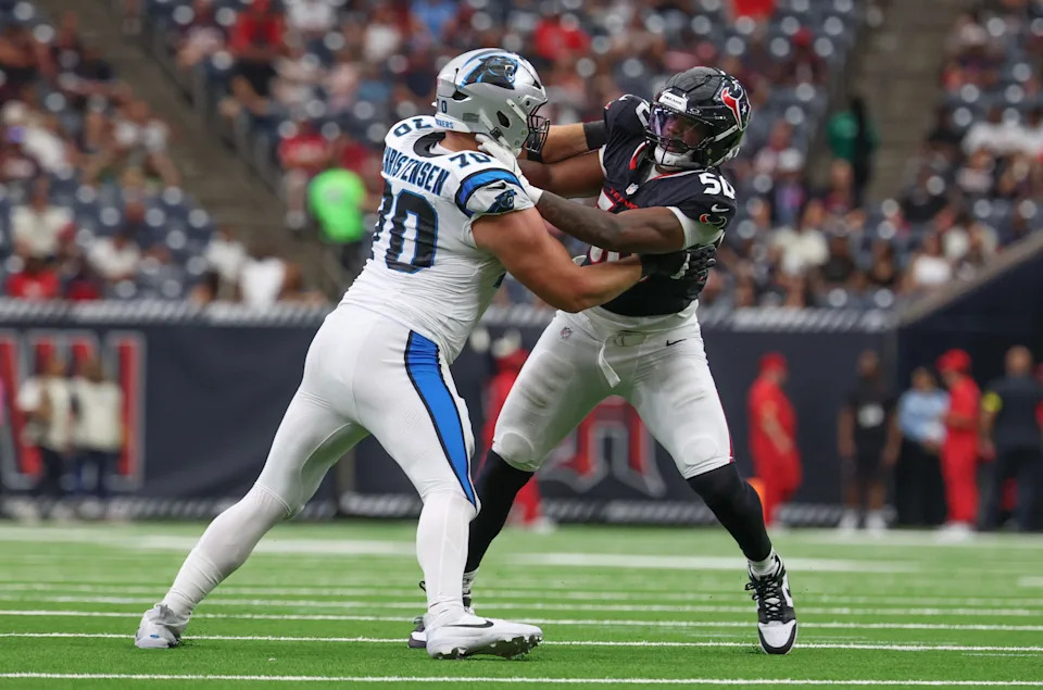 Aug 16, 2025; Houston, Texas, USA; Carolina Panthers guard Brady Christensen (70) blocks Houston Texans defensive end Solomon Byrd (50) in the second half at NRG Stadium. Mandatory Credit: Thomas Shea-Imagn Images