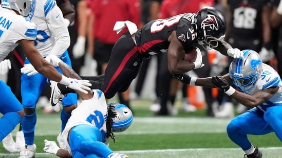Detroit Lions safety Morice Norris (26) is hit in the helmet by Atlanta Falcons running back Nathan Carter (38) during the second half of an NFL preseason football game Friday, Aug. 8, 2025, in Atlanta.(AP)