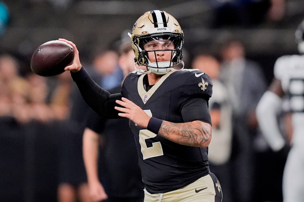New Orleans Saints quarterback throwing a football.