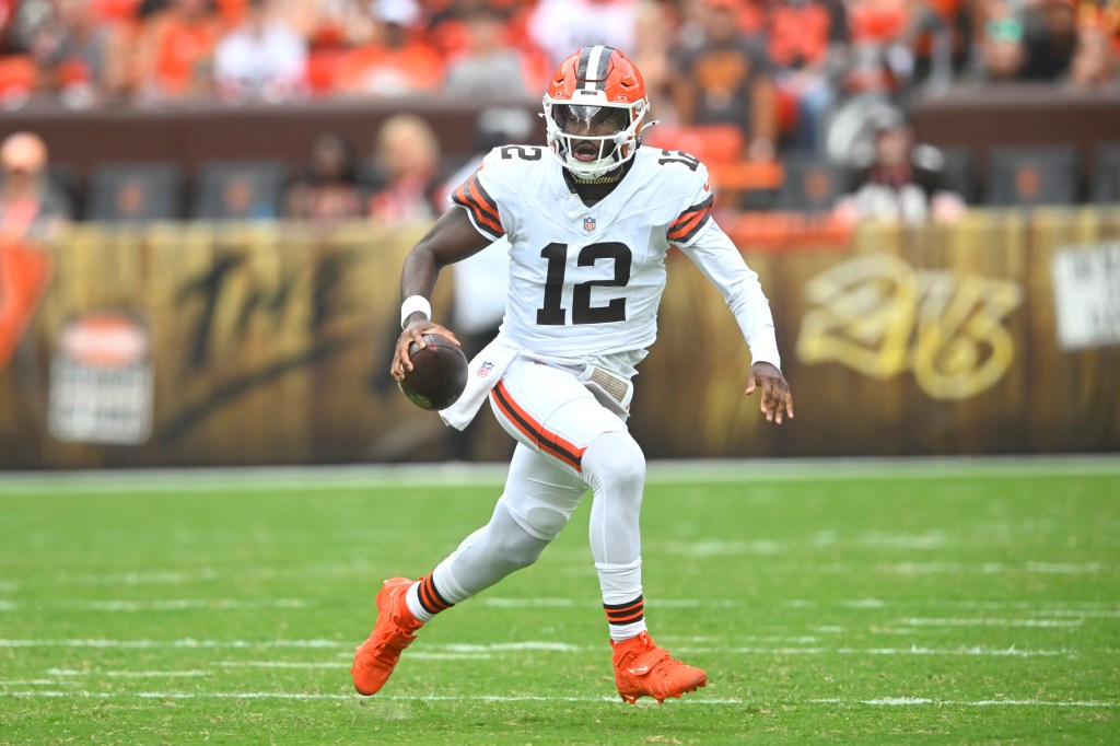 Cleveland Browns quarterback running with football.