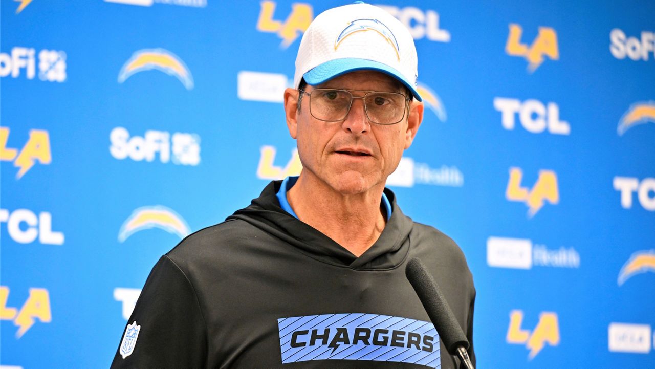 Los Angeles Chargers head coach Jim Harbaugh responds to questions during a news conference after the team's preseason NFL football game against the Dallas Cowboys, Saturday, Aug. 24, 2024, in Arlington, Texas. (AP Photo/Jerome Miron)