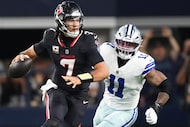 Houston Texans quarterback C.J. Stroud (7) scrambles away from Dallas Cowboys linebacker...