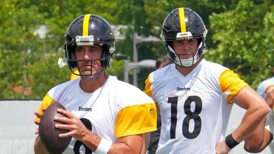 Pittsburgh Steelers quarterbacks Aaron Rodgers (8) looks to pass as Will Howard (18) waits his turn (AP)