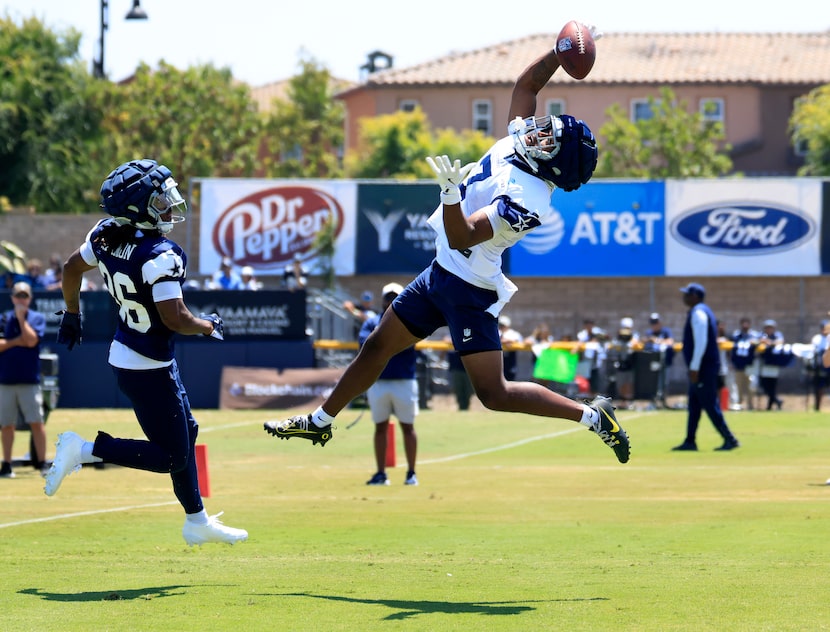 Dallas Cowboys wide receiver Traeshon Holden (7) goes high in the end zone to catch a...