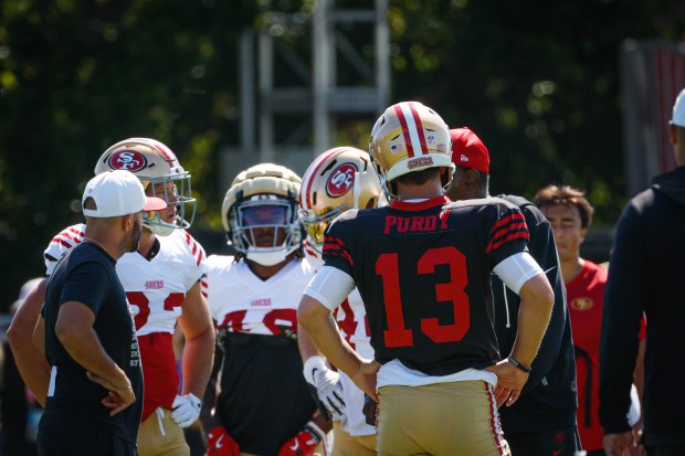 San Francisco 49ers' quarterback Brock Purdy (13) stands in a huddle during practice at Levi's Stadium in Santa Clara, Calif., on Tuesday, Aug. 12, 2025. (Shae Hammond/Bay Area News Group)