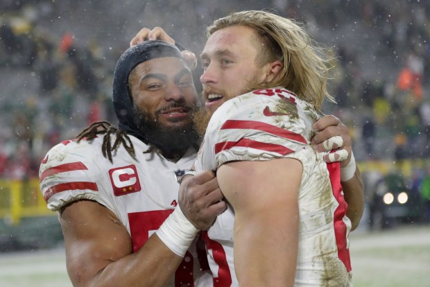 San Francisco 49ers' Fred Warner and George Kittle celebrate after an NFC divisional playoff NFL football game against the Green Bay Packers Saturday, Jan. 22, 2022, in Green Bay, Wis. The 49ers won 13-10 to advance to the NFC Chasmpionship game. (AP Photo/Aaron Gash)