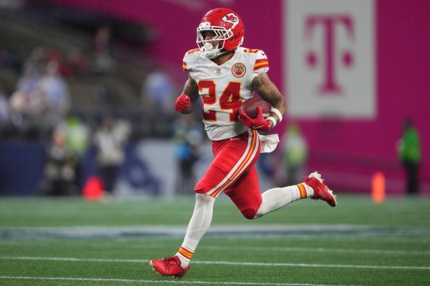 Kansas City Chiefs wide receiver Skyy Moore (24) runs a punt return for a touchdown during the second half of an NFL preseason football game against the Seattle Seahawks, Friday, Aug. 15, 2025, in Seattle. (AP Photo/Lindsey Wasson)