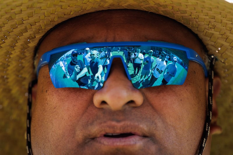The reflection of reporters can be seen in the sunglasses of BYU football coach Kalani Sitake during fall camp in Provo on Aug. 5, 2025. The college football landscape has changed dramatically since Sitake took over the program 11 years ago, but is BYU built to not only survive, but thrive in this new normal?