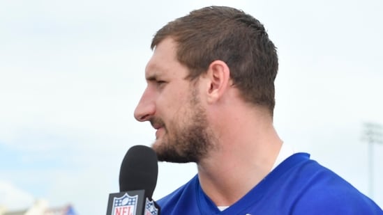 NFL Network's Michael Robinson, left, interview Buffalo Bills defensive end Joey Bosa after practice at the team's NFL football training camp, Sunday, July 27, 2025, in Pittsford, N.Y. (AP Photo/Adrian Kraus)(AP)
