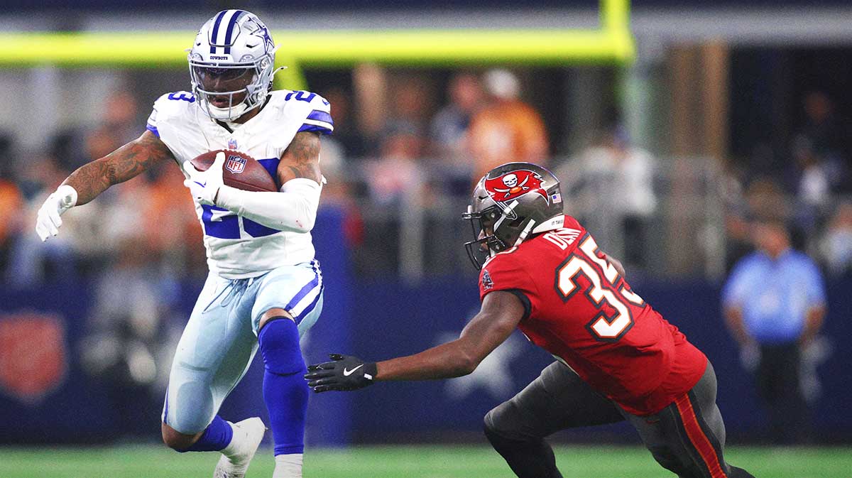 Dallas Cowboys running back Rico Dowdle (23) runs the ball against Tampa Bay Buccaneers cornerback Jamel Dean (35) in the second half at AT&T Stadium.