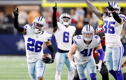 Dallas Cowboys cornerback DaRon Bland (26) celebrates after ripping the ball from Tampa Bay...