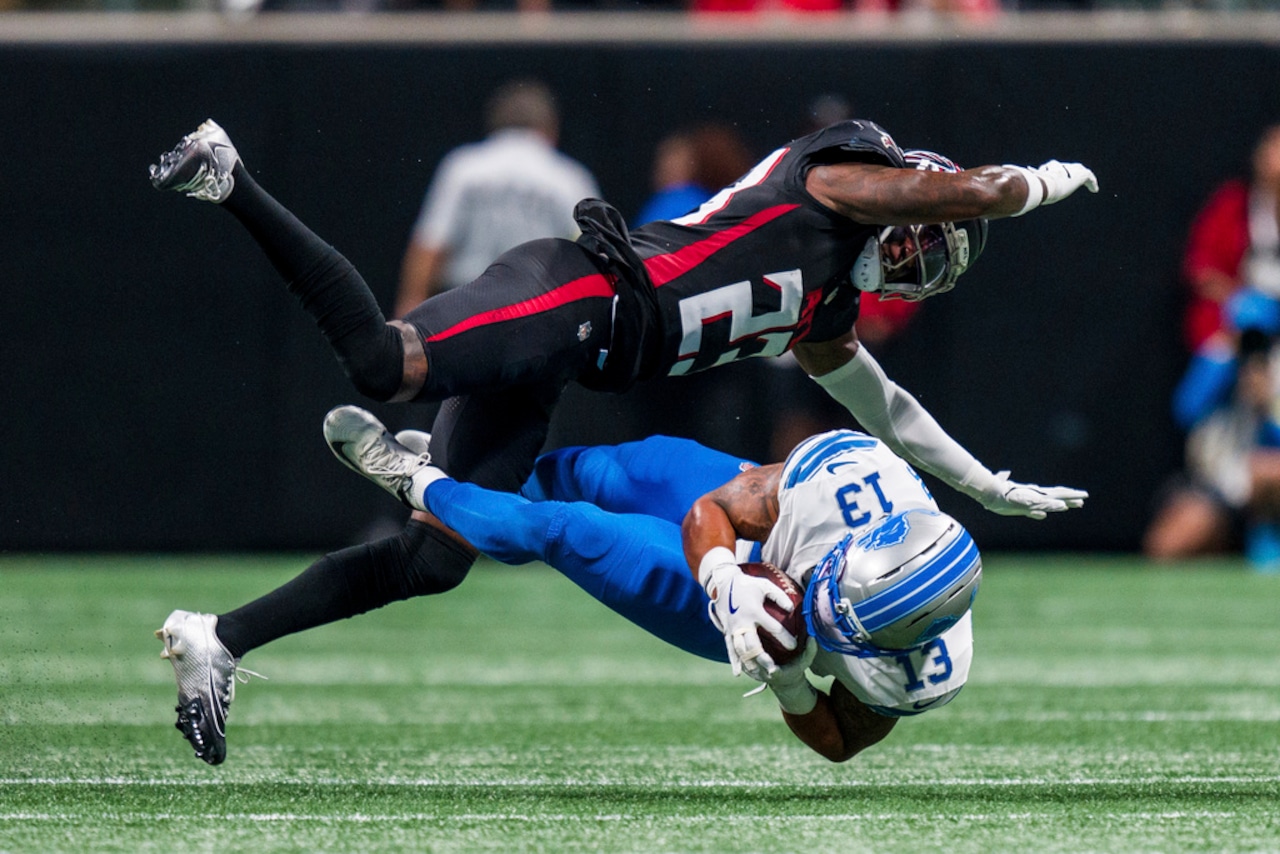 Atlanta Falcons safety DeMarcco Hellams tackles Detroit Lions running back Craig Reynolds during an NFL preseason game on Friday, Aug. 8, 2025, at Mercedes-Benz Stadium in Atlanta.