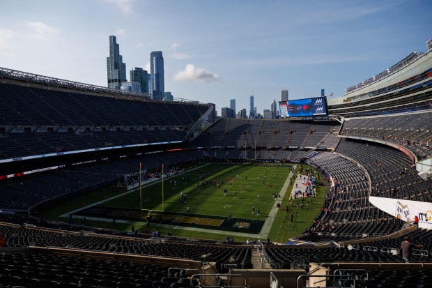 Chicago Bears and Buffalo Bills players warm up before the...