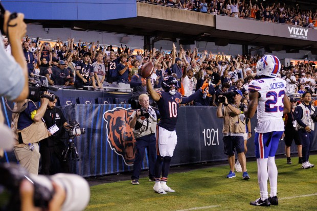 Chicago Bears wide receiver Tyler Scott (10) celebrates after scoring...