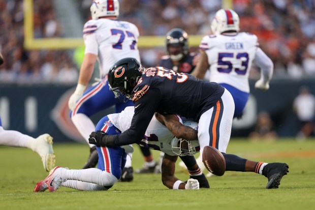 Chicago Bears defensive end Dayo Odeyingbo (55) tackles Buffalo Bills...