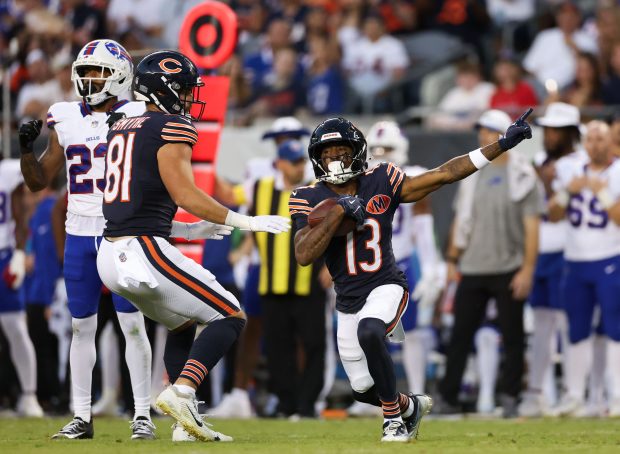 Chicago Bears wide receiver Maurice Alexander (13) points after running...