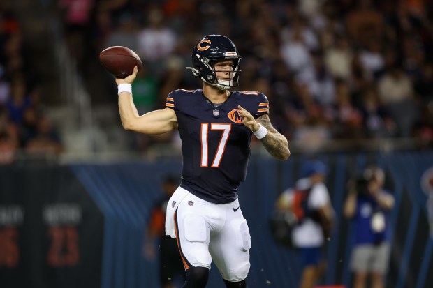 Chicago Bears quarterback Tyson Bagent (17) looks before throwing a...