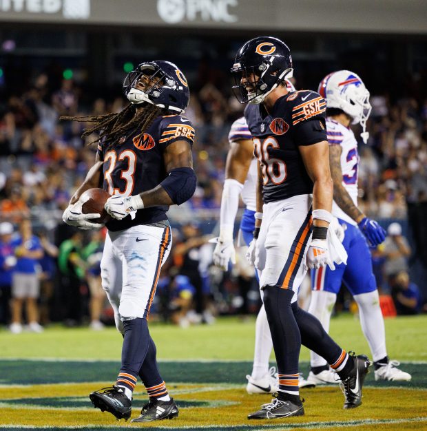 Bears running back Ian Wheeler celebrates after scoring a touchdown...