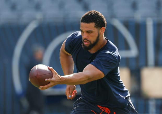 Chicago Bears quarterback Caleb Williams (18) runs through plays before the start of a game against the Miami Dophins at Soldier Field on Aug. 10, 2025, in Chicago. (Stacey Wescott/Chicago Tribune)