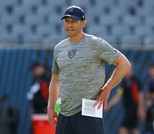 Chicago Bears head coach Ben Johnson watches his starters run through plays before the start of a game against the Miami Dophins at Soldier Field on Aug. 10, 2025, in Chicago. (Stacey Wescott/Chicago Tribune)
