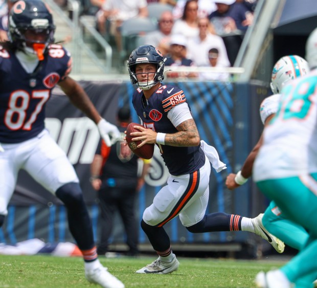 Chicago Bears quarterback Tyson Bagent (17) rolls out and looks for an open receiver in the first half of a game against the Miami Dolphins at Soldier Field on Aug. 10, 2025, in Chicago. The game ended in a 24-24 tie. (Stacey Wescott/Chicago Tribune)