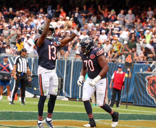 Chicago Bears wide receiver Maurice Alexander (13) raises his arms toward the crowd after scoring a touchdown in the first half during a game against the Miami Dophins at Soldier Field on Aug. 10, 2025, in Chicago. (Stacey Wescott/Chicago Tribune)
