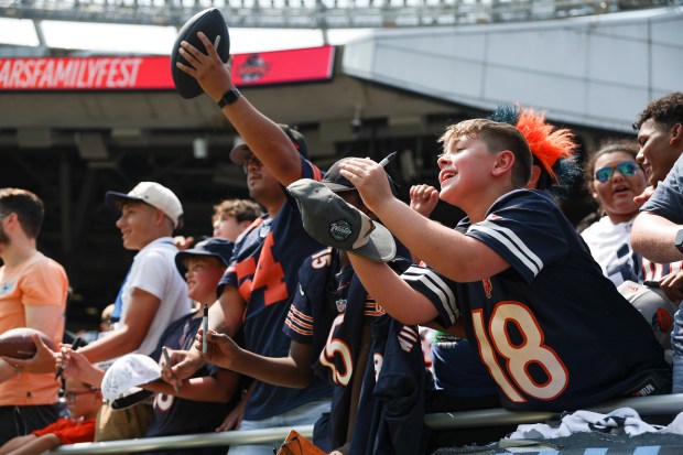 Chicago Bears fans reach out for autographs from players at the end of Chicago Bears Family Fest at Soldier Field on Sunday, Aug. 3, 2025. (Eileen T. Meslar/Chicago Tribune)