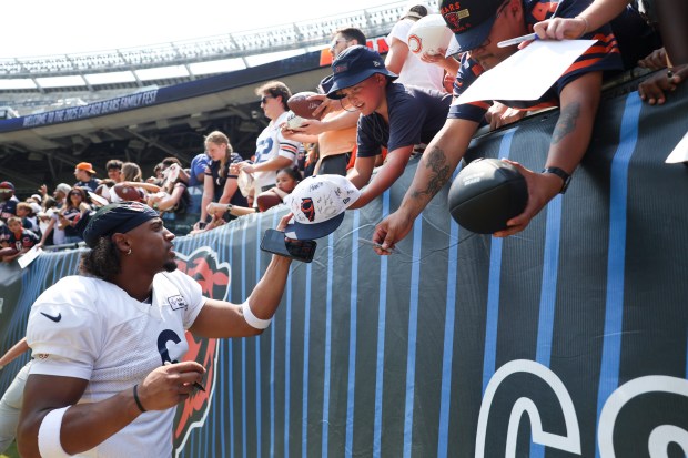 Chicago Bears cornerback Kyler Gordon (6) signs autographs for fans at the end of Chicago Bears Family Fest at Soldier Field on Sunday, Aug. 3, 2025. (Eileen T. Meslar/Chicago Tribune)
