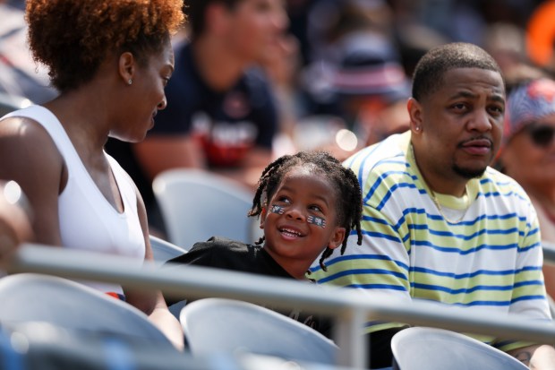 A Chicago Bears fan smiles during Chicago Bears Family Fest at Soldier Field on Sunday, Aug. 3, 2025. (Eileen T. Meslar/Chicago Tribune)
