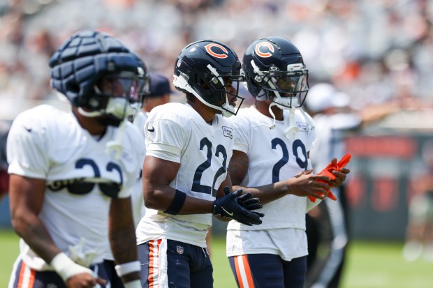 Chicago Bears safety Elijah Hicks (22) and cornerback Tyrique Stevenson (29) warm up during Chicago Bears Family Fest at Soldier Field on Sunday, Aug. 3, 2025. (Eileen T. Meslar/Chicago Tribune)
