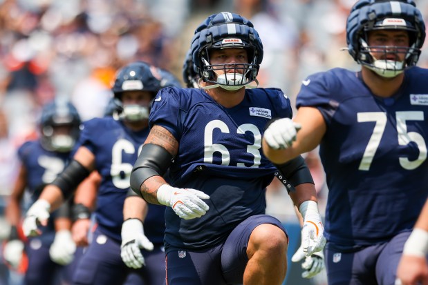Chicago Bears guard Chris Glaser (63) warms up with teammates during Chicago Bears Family Fest at Soldier Field on Sunday, Aug. 3, 2025. (Eileen T. Meslar/Chicago Tribune)