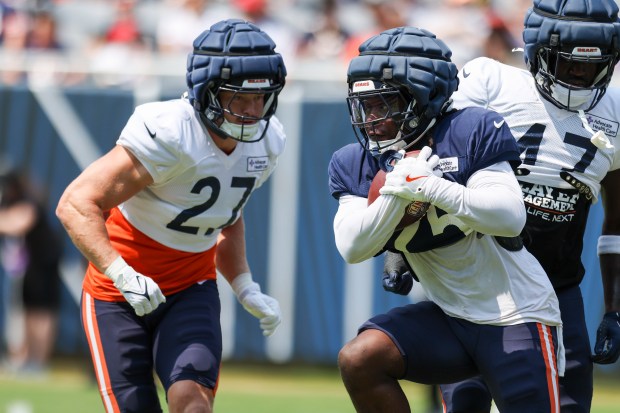 Chicago Bears running back Kyle Monangai (25) tries to get past linebacker Swayze Bozeman (27) during Chicago Bears Family Fest at Soldier Field on Sunday, Aug. 3, 2025. (Eileen T. Meslar/Chicago Tribune)