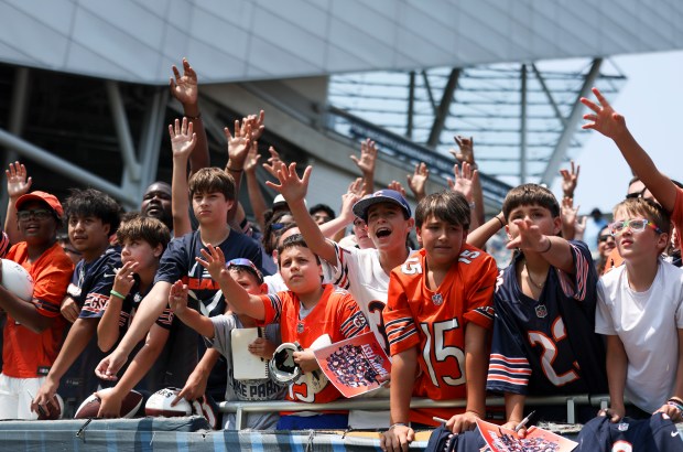 Chicago Bears fans reach out for autographs from players at the end of Chicago Bears Family Fest at Soldier Field on Sunday, Aug. 3, 2025. (Eileen T. Meslar/Chicago Tribune)