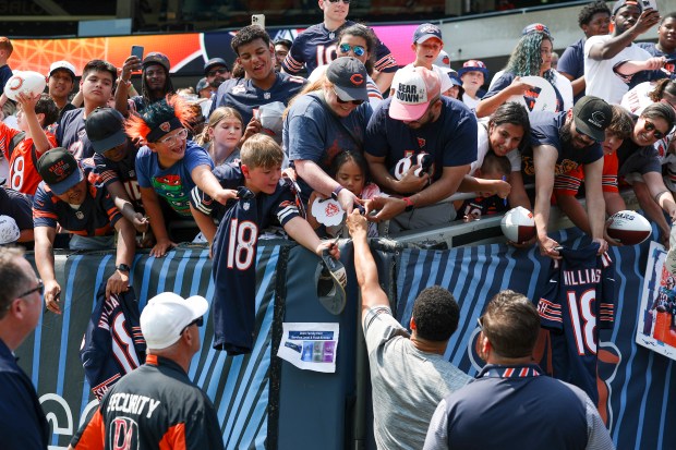 Chicago Bears quarterback Caleb Williams hands his sweat band to a young fan at the end of Chicago Bears Family Fest at Soldier Field on Sunday, Aug. 3, 2025. (Eileen T. Meslar/Chicago Tribune)