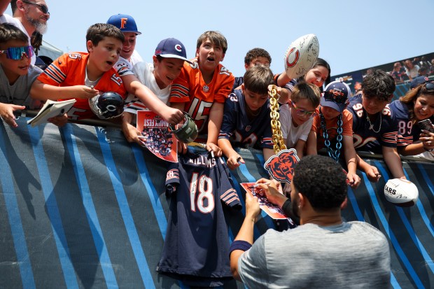 Chicago Bears quarterback Caleb Williams signs autographs for fans at the end of Chicago Bears Family Fest at Soldier Field on Sunday, Aug. 3, 2025. (Eileen T. Meslar/Chicago Tribune)