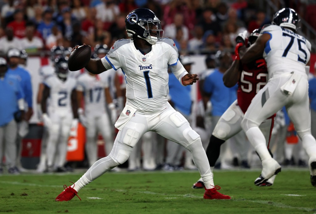 Cam Ward throws a pass during the Titans' preseason road loss to the Buccaneers.